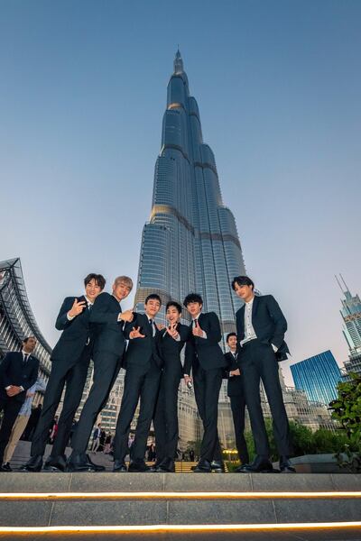 Members of Exo pose in front of the Burj Khalifa. Courtesy Dubai Tourism