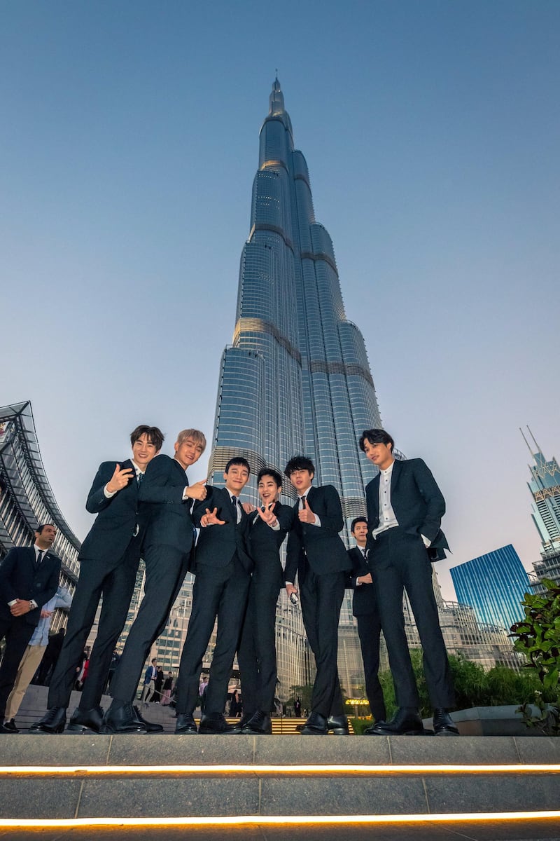 Members of Exo pose in front of the Burj Khalifa during their visit to Dubai last year. Courtesy Dubai Tourism