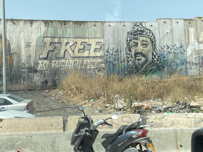 A mural of Yasser Arafat in Ramallah bears the slogan 'Free Barghout'. Thomas Harding/ The National