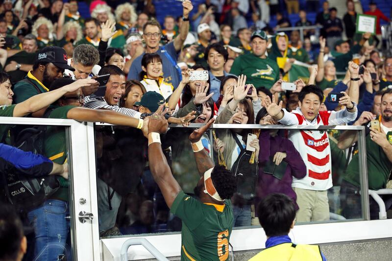 South Africa's captain Siya Kolisi (C) celebrates with supporters after winning the Rugby World Cup 2019 semi final match between South Africa and Wales at the International Stadium Yokohama in Yokohama City, Japan.  EPA
