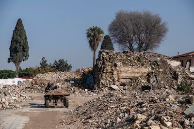 A scrap merchant's cart parked between heaps of rubble in Antakya. Antonie Robertson / The National
