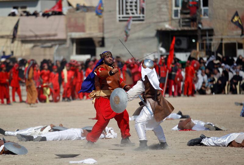 Local actors dressed as ancient warriors re-enact a scene from the 7th century battle of Kerbala during the religious festival of Ashura in Baghdad, Iraq. Khalid al-Mousily / Reuters