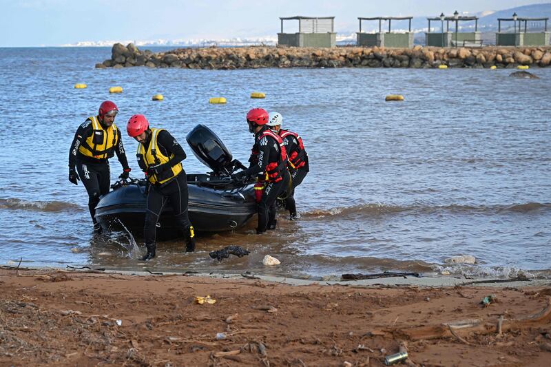 Members of the UAE rescue team assist in relief work. AFP