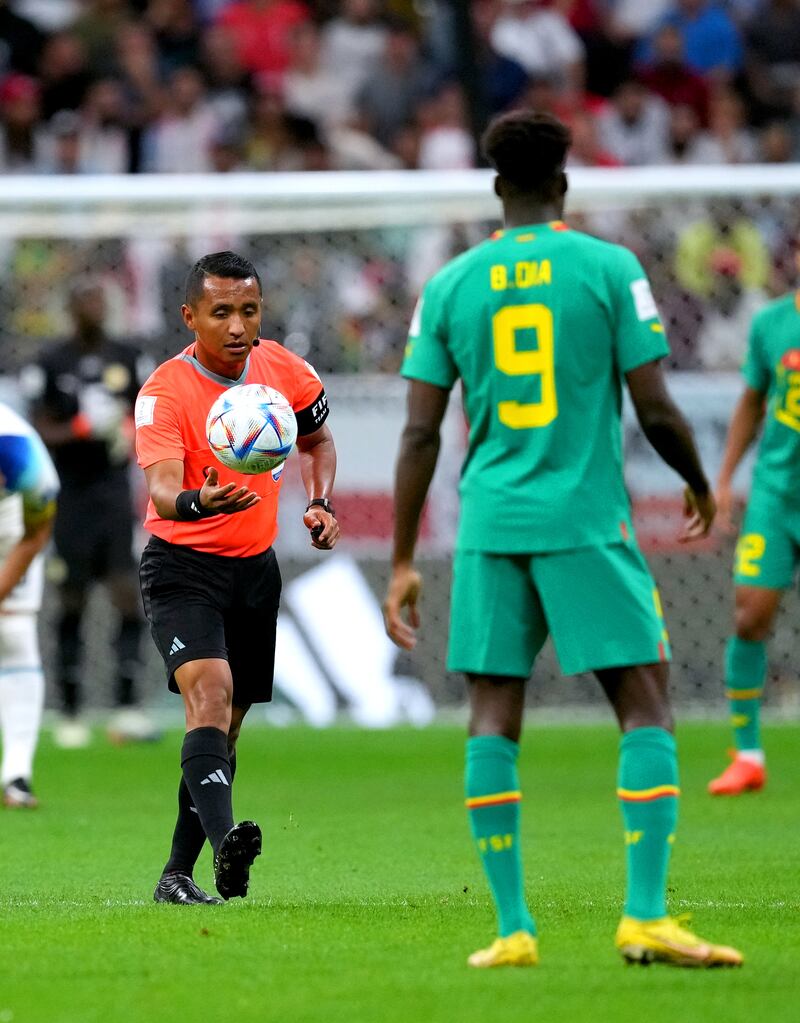 Referee Ivan Arcides Barton Cisneros changes the ball after it went flat. PA