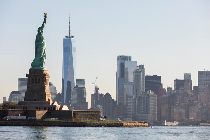 The Statue of Liberty and the skyline of Manhattan is seen from the water on the 20th anniversary of the September 11 attacks in New York City, New York, U. S. , September 11, 2021.   REUTERS / Bjoern Kils / New York Media Boat