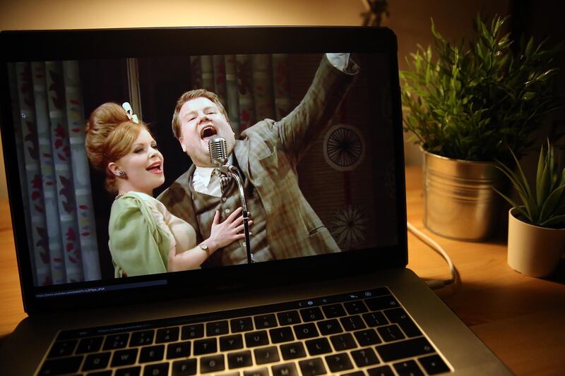 LONDON, ENGLAND - APRIL 02:  In this photo illustration, James Corden is seen on the screen of a laptop streaming "One Man, Two Guvnors" during a "National Theatre at Home" broadcast on April 2, 2020 in London, England. Due to Government's guidelines amid the Coronavirus pandemic, theatres have had to close their doors. This is part of "National Theatre At Home" series, bringing the stage to the screen by streaming several iconic plays on YouTube every Thursday.  (Photo by Simone Joyner/Getty Images)