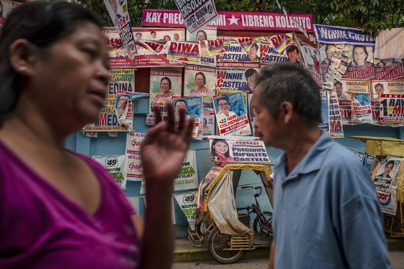 MANILA, PHILIPPINES - MAY 12: Campaign posters are seen along a street on May 12, 2019 in Quezon city, Metro Manila, Philippines. About 60 million Filipino voters will head to the polls on May 13 for the congressional midterms to elect local lawmakers and government officials in the Philippines. Based on reports, Monday's midterm elections will be a test on Filipino President Rodrigo Duterte's popularity as recent polls show that his administration remains popular ahead of the midterm elections despite receiving largely negative attention overseas. (Photo by Ezra Acayan/Getty Images)