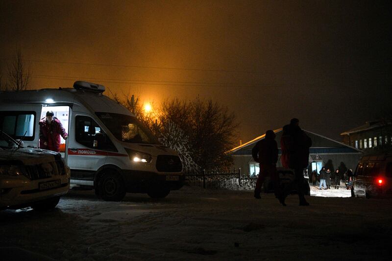 An ambulance is parked at the Listvyazhnaya coal mine in Russia's Kemerovo region as rescuers try to locate missing miners on November 25. AFP