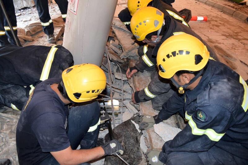 The Almaarefa University building in Diriyah, on the western outskirts of the city, was evacuated when an outer wall and parking garage roof caved in.  Courtesy, Twitter of the General Directorate of Saudi Civil Defence