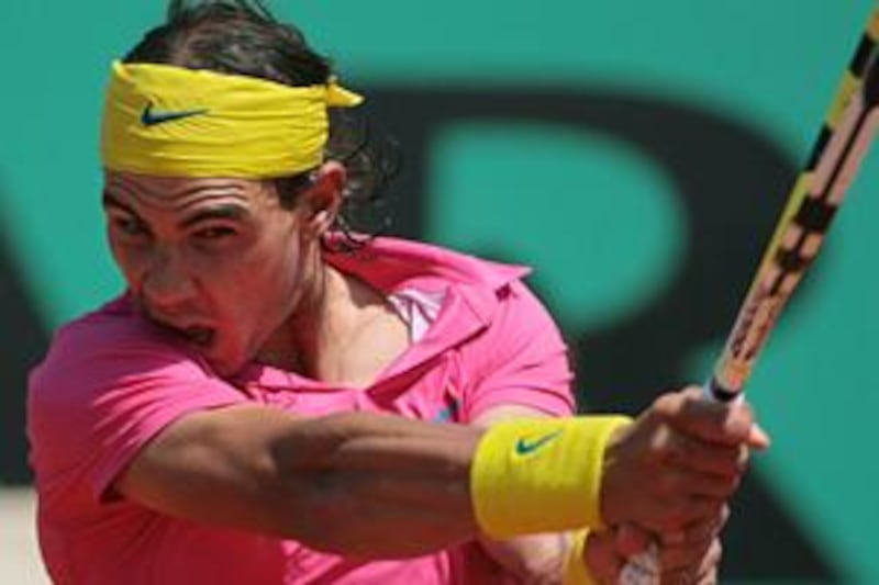 Rafael Nadal unleashes one of his trademark double-handed ground strokes during his straight sets victory over Brazil's Daniel Marcos at the French Open.