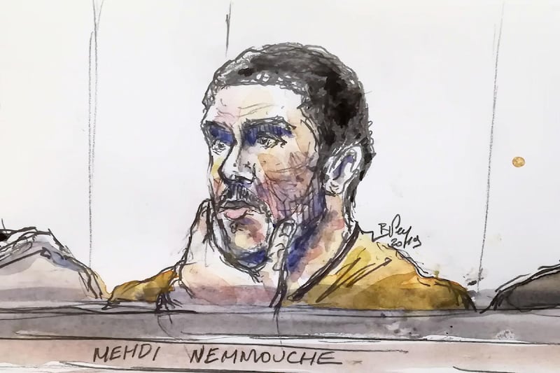 (FILES) This file court sketch made on January 10, 2019 shows Mehdi Nemmouche, accused of the terrorist attack at the Jewish Museum in Brussels in 2014, during his trial at the Brussels Justice Palace. The French jihadist who shot dead four people in a terrorist attack at a Jewish museum was sentenced to life in prison by a Brussels court on March 12, 2019. Mehdi Nemmouche was convicted last week of "terrorist murder" for the anti-Semitic gun rampage in the Belgian capital in May 2014, a crime committed following his return from Syria's battlefields. / AFP / BENOIT PEYRUCQ
