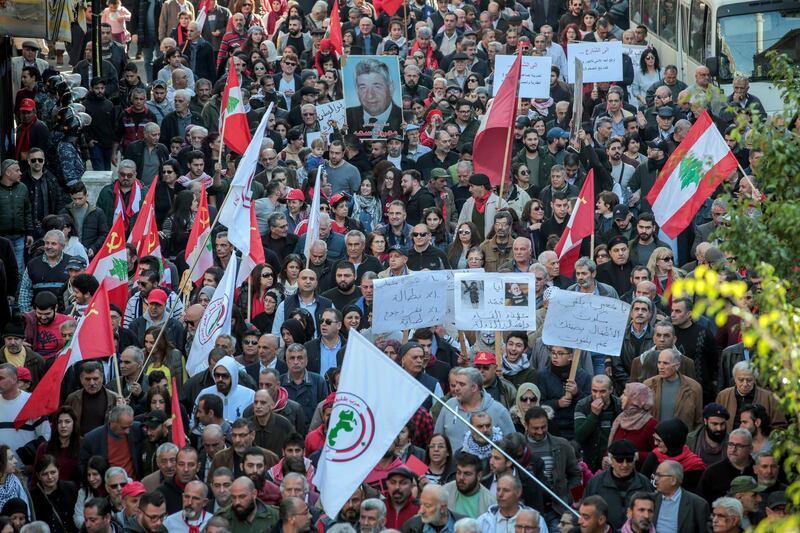 Supporters of the Lebanese communist party march as they carry their party's flags during a protest in Beirut, Lebanon. EPA