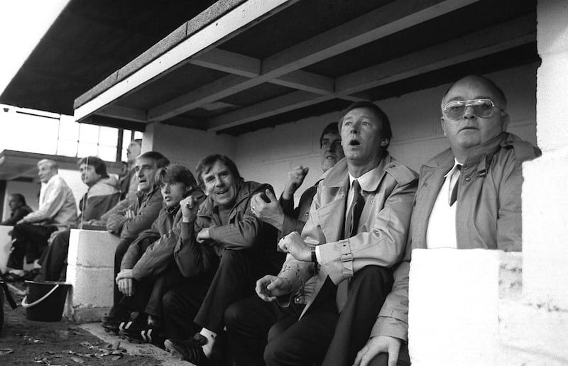 Manchester United manager Alex Ferguson (second r) watches his new team for the first time as they crash to a 2-0 defeat
