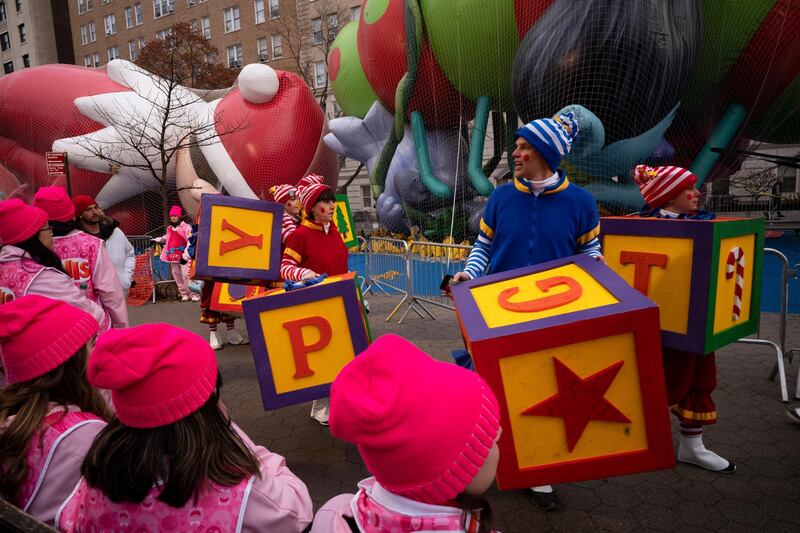 Despite heavy winds, the traditional Macy's Thanksgiving Day Parade went ahead in New York but many balloons had to fly closer to the ground. AP
