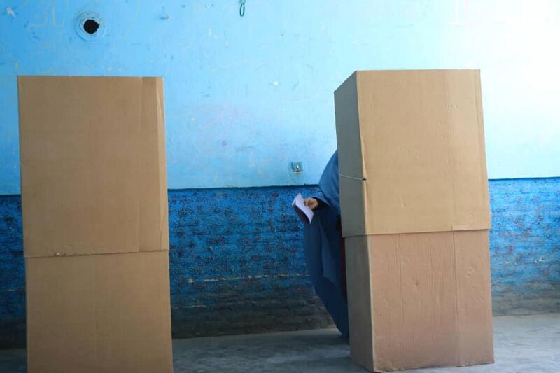 A woman votes in parliamentary elections in Herat, Afghanistan. Shafi Amini