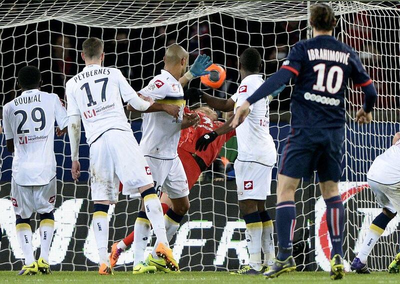Zlatan Ibrahimovic scores during PSG's win on Saturday. Franck Fife / AFP