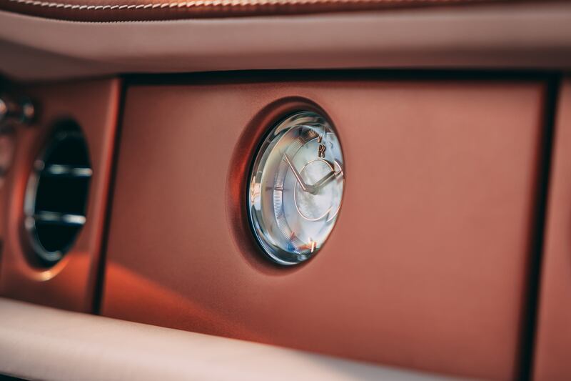 The Boat Tail features a clock with mother-of-pearl accents.