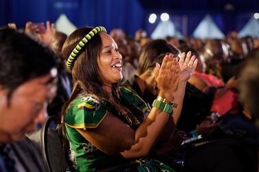 A dignitary dressed in the colours of the African National Congress applauds as the final results are announced at the results ceremony at the Independent Electoral Commission Results Center in Pretoria, South Africa Saturday, May 11, 2019. South Africa's ruling African National Congress on Saturday marked its weakest victory in national elections in a quarter-century. AP Photo