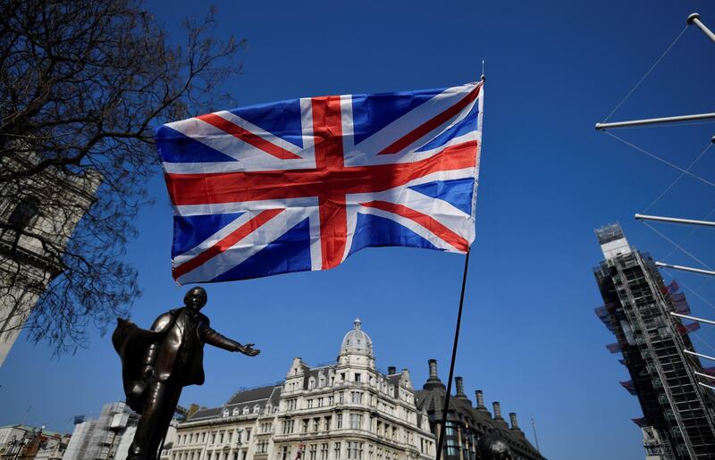 A British flag flutters during the March to Leave demonstration in Parliament square in London, Britain March 29, 2019. REUTERS/Toby Melville