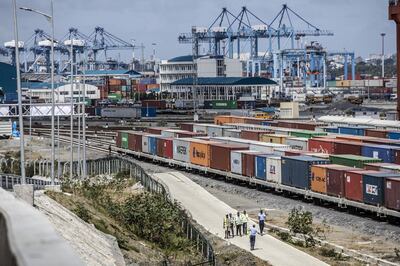 Shipping containers sit beside railway lines running into Mombasa port, operated by Kenya Ports Authority, in Mombasa, Kenya, on Saturday, Sept. 1, 2018. China's modern-day adaptation of the Silk Road, known as the Belt and Road Initiative, aims to revive and extend trading routes connecting China with Central Asia, the Middle East, Africa and Europe via networks of upgraded or new railways, ports, pipelines, power grids and highways. Photographer: Luis Tato/Bloomberg