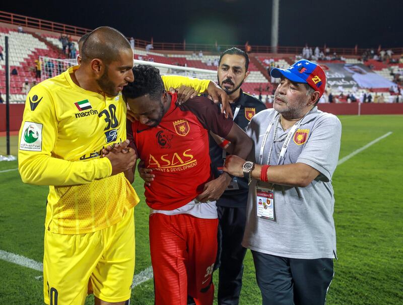 Fujairah, UAE, April 27, 2018.  Final round of 2017/18 First Division. Diego Maradona and Fujairah set to seal promotion to the Arabian Gulf League.   Fujairah v Khorfakkan,
  Diego Maradona comforts Mohamed Khalfan after the match.
Victor Besa / The National
Sports
Reporter: John McAuley.