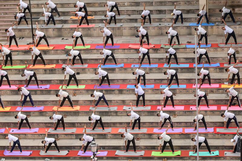 Border Security Force personnel take part in a yoga session on the International Day of Yoga, at the India-Pakistan Wagah border. AFP