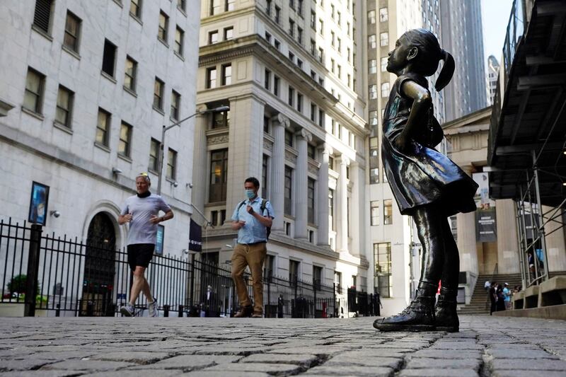 The 4-foot bronze Fearless Girl statue that was installed opposite New York City's Charging Bull in 2017 will remain in its current spot opposite the New York Stock Exchange at least until early 2023. AP