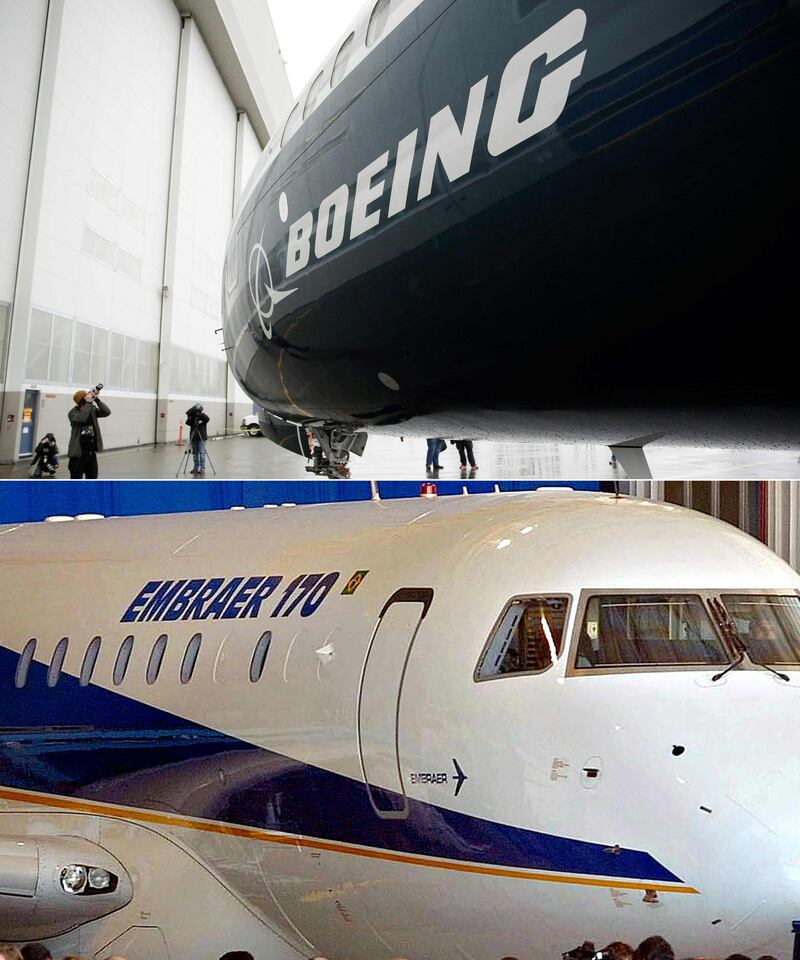 (COMBO) This combination of file pictures created on July 05, 2018 shows the first Boeing 737 MAX 9 airplane (top) at the Boeing factory in Renton, Washington, on March 7, 2017; and Embraer's new passenger jet, the ERJ 170 during a ceremony at the company's manufacturing plant in Sao Jose de los Campos, Brazil, 29 October, 2001.  Boeing is taking over the commercial jet business of Brazil's Embraer valued at $4.75 billion in a move that will allow it to compete more effectively in the medium-range aircraft market. It follows a similar strategic partnership by arch-rival Airbus with Canada's Bombardier last October. Under the terms of the deal, Boeing will hold an 80 percent stake valued at $3.8 billion, the companies said in a release on July 5, 2018, while Embraer will hold the remaining 20 percent.
 / AFP / Jason Redmond AND MAURICIO LIMA
