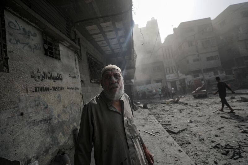 A Palestinian man surveys a destroyed area after Israeli air strikes in Gaza city. EPA