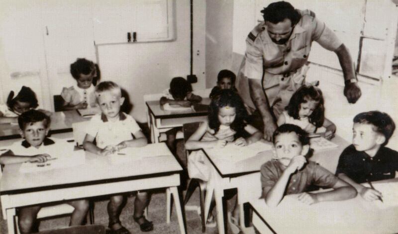 Flt Lt F Loughman and the founding class of Dubai English Speaking School in 1963. The classroom was an upstairs room of a villa where expatriate workers were housed. Photo: Dubai English Speaking School