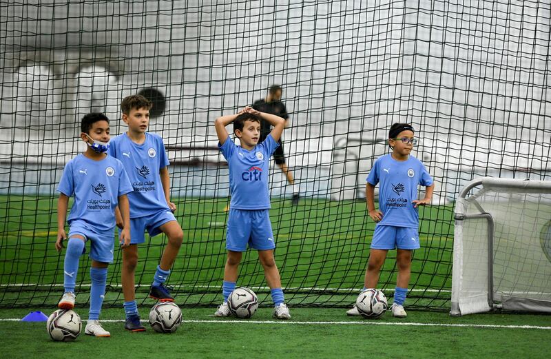 Manchester City Football-AD  Young kids from the Manchester City Football club excited to take part for the Champions League next weekend at the OfficerÕs Club Indoor Club on May 23, 2021. Khushnum Bhandari / The National 
Reporter: Gillian Duncan News
