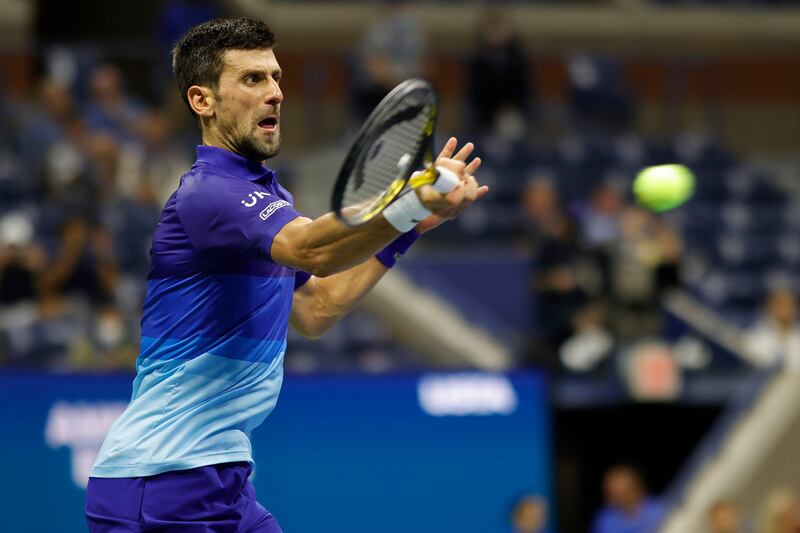 Novak Djokovic of Serbia hits a forehand against Matteo Berrettini of Italy. Reuters