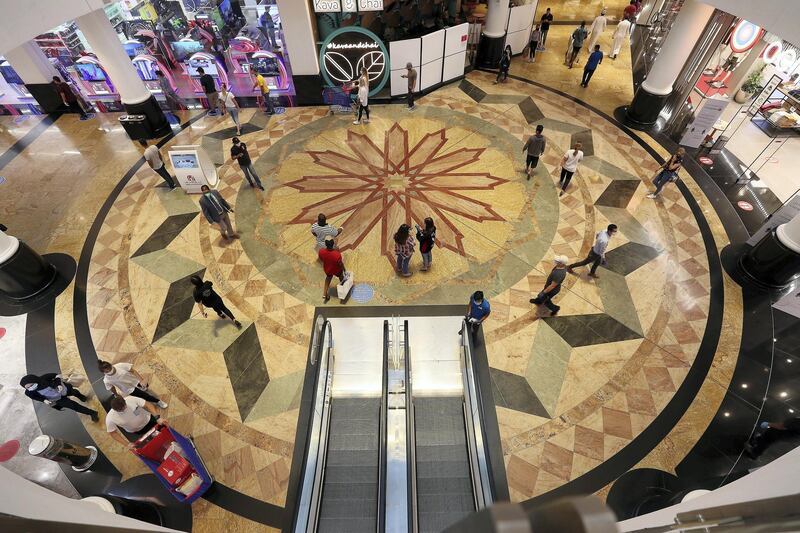 DUBAI, UNITED ARAB EMIRATES , April 29 – 2020 :- Shoppers wearing protective face mask to prevent the spread of the coronavirus at Mall of the Emirates in Dubai. Authorities ease the restriction for the residents in Dubai. At present mall opening timing is 12:00 pm to 10:00 pm. Carrefour timing is 9:00 am to 10:00 pm. (Pawan Singh / The National) For News/Standalone/Online. Story by Patrick