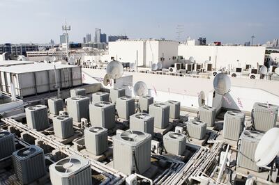 A Dubai rooftop is crowded with air-conditioning units and satellite dishes. Sarah Dea / The National