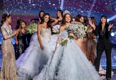 epa07060480 Lebanese Maya Reaidy (C) poses after winning the Miss Lebanon 2018 beauty pageant, next to Lebanese-American actress Miss USA 2010 Rima Fakih (R) and Miss Universe 2017 Demi-Leigh Nel-Peters (L) at forum De Beirut in Beirut, Lebanon, 30 September 2018.  EPA/NABIL MOUNZER