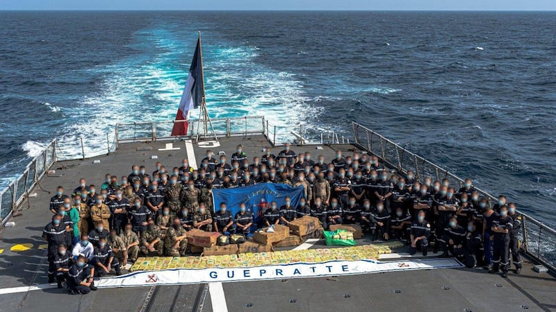 The FS Guepratte ship’s company on the flight deck, with the narcotics seized from a vessel in the Arabian Sea. Marine Nationale