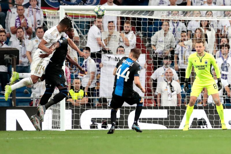 Real Madrid's Casemiro, left, scores against Brugge during the Champions League group A soccer match between Real Madrid and Club Brugge, at the Santiago Bernabeu stadium in Madrid. AP Photo