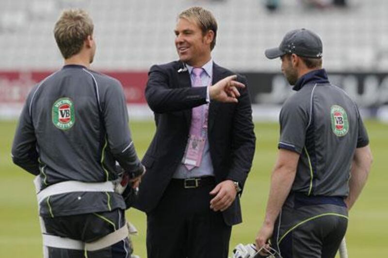 Shane Warne, centre, is Test cricket's second-highest wicket-taker. Ian Kington / AFP