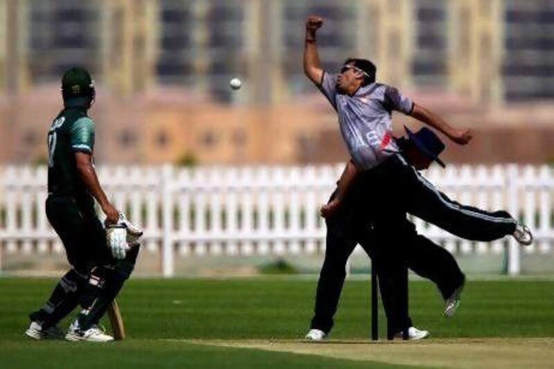 UAE's Khurram Khan, second right, celebrates with teammates as their rivals Saudi Arabia were bowled out cheaply.