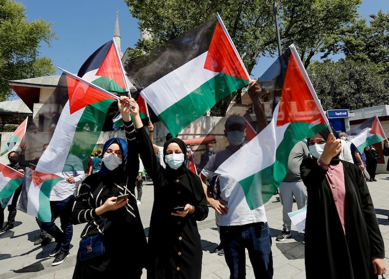 Protesters wave Palestinian flags at a demonstration to express solidarity with the Palestinian people, after Friday prayers in Istanbul, Turkey. Reuters