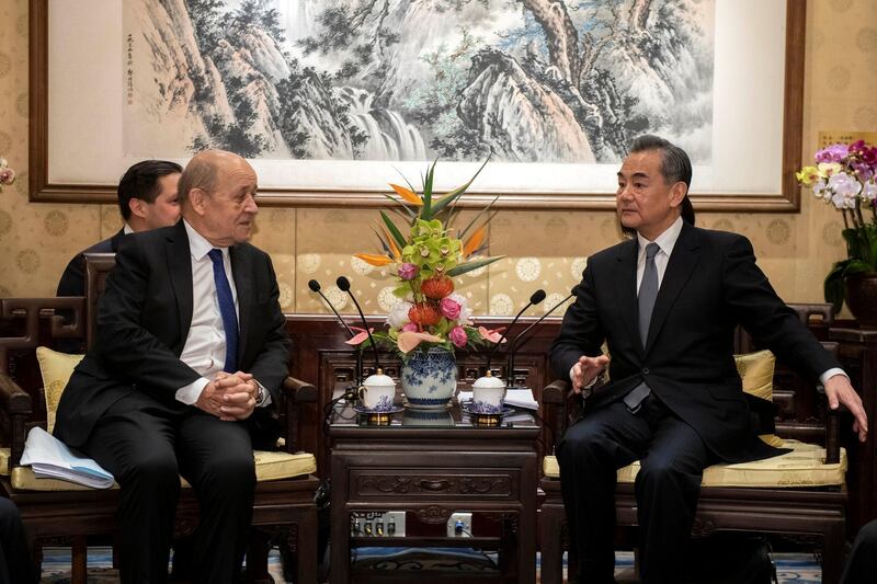 China's Foreign Minister Wang Yi meets for talks with his French counterpart Jean-Yves Le Drian at Diaoyutai State Guesthouse in Beijing, China. Reuters