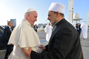 Pope Francis shakes hands with Grand Sheik Ahmed al Tayeb as he arrives for a meeting with members of Muslim Council of Elders at Grand Mosque of Sheik Zayed in Abu Dhabi. EPA/VATICAN MEDIA HANDOUT 