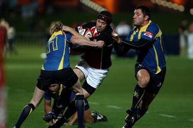 UAE centre Scott Kerr, centre, in action against Kazakhstan at Zayed Sports City in Abu Dhabi on April 29, 2011. Pawan Singh / The National