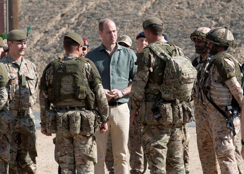 Britain's Prince William talks to troops after observing joint training exercises between Kuwait Armed Forces and British Army, in Subiya, Kuwait. REUTERS