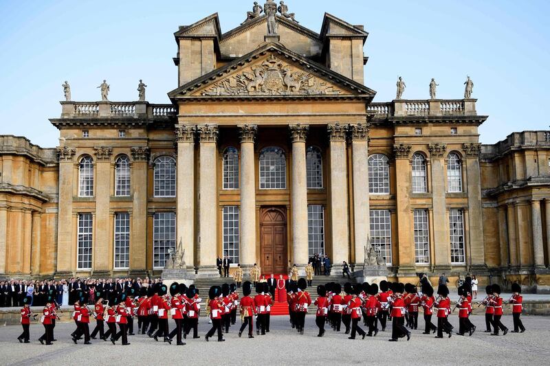 The bands of the Scots, Irish and Welsh Guards perform a ceremonial welcome in the Great Court of Blenheim Palace. AFP