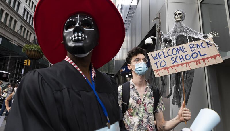 People gather for a protest against plans to reopen schools in the midst of the coronavirus pandemic in New York. EPA