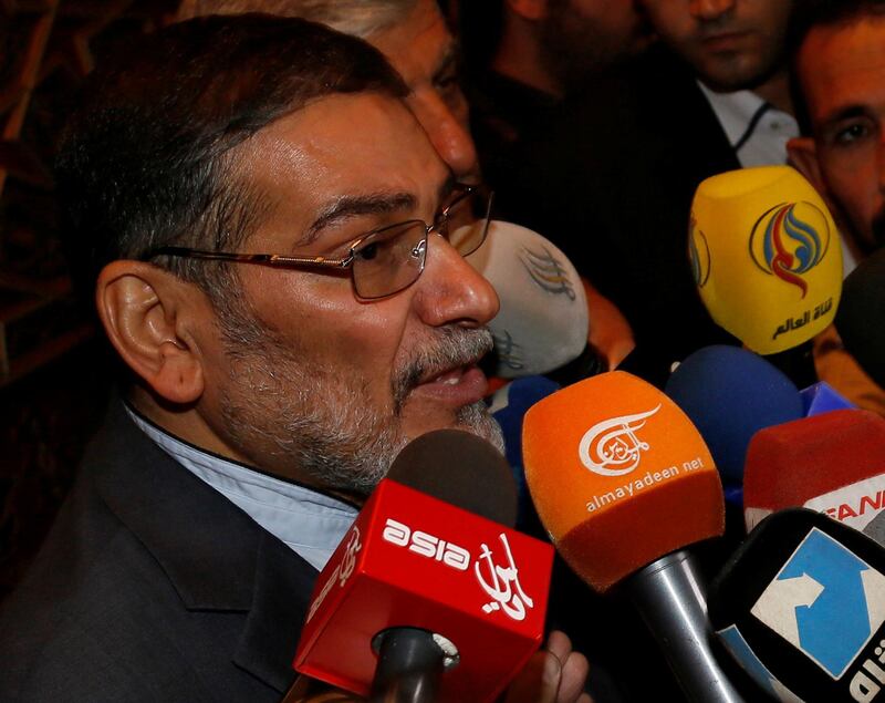 FILE PHOTO: Admiral Ali Shamkhani, Iran?s Supreme National Security Council Director, speaks to the media after his arrival at Damascus airport, September 30, 2014. REUTERS/Khaled al-Hariri/File Photo