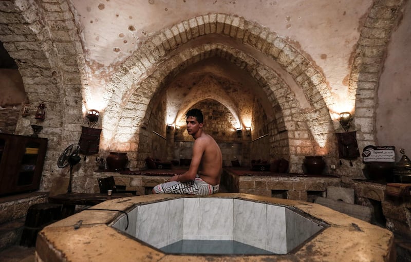 A Palestinian man relaxes at the ancient Hamam Al Samra, a traditional Turkish steam bath, in Gaza city. AFP