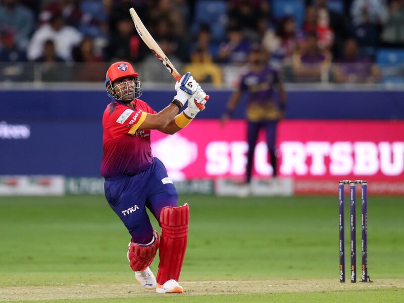 Dubai Capitals' Robin Uthappa hits a boundary. 