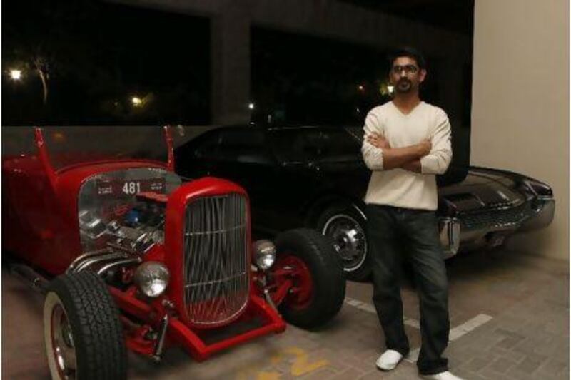 Gaurav Dhar with two of his classic cars. Jeffrey E Biteng / The National